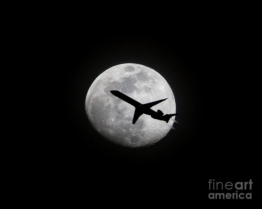 Airliner Passing in Front of a Full Moon by Kevin McCarthy Airliner Passing in Front of a Full Moon by Kevin McCarthy
