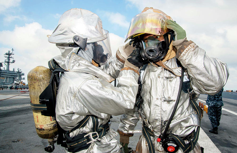 Airmen Don Proximity Suits Photograph by Stocktrek Images | Fine Art ...