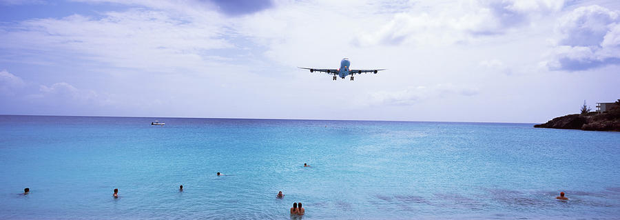 Airplane Flying Over The Sea, Maho Photograph by Panoramic Images ...