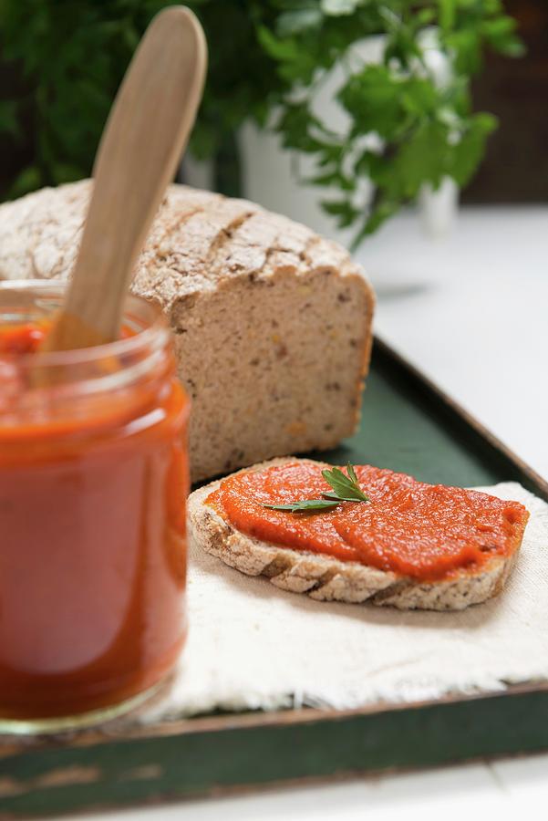 Ajvar pepper Mousse In A Jar And On A Slice Of Bread Photograph by Komar