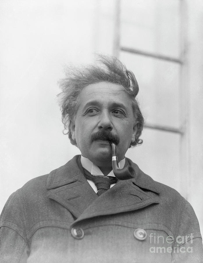 Albert Einstein Photograph - Albert Einstein Smoking A Pipe by Bettmann