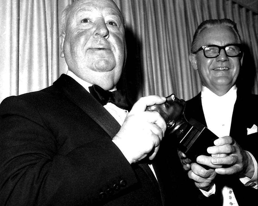 Black And White Photograph - Alfred Hitchcock Receiving The Irvin G. Thalberg Memorial Award At The Oscars Ceremony by Globe Photos