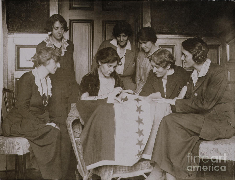 Flag Photograph - Alice Paul Sewing Stars On The Suffrage Flag As Other Women Look On, C.1920 by American Photographer