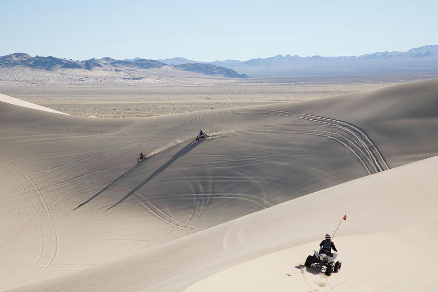 All Terrain Motorcycles Driving Over Photograph by Per Breiehagen All Terrain Motorcycles Driving Over Photograph by Per Breiehagen