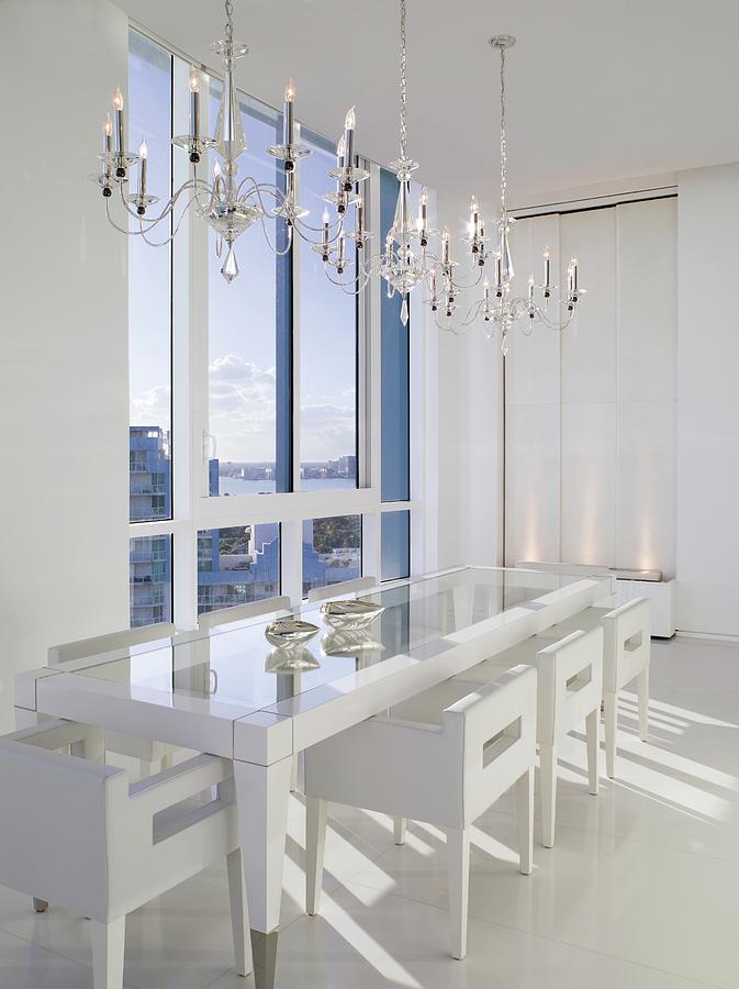 All White Dining Room With Triple Chandeliers Photograph by Ken Hayden