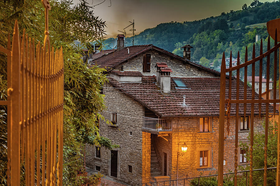 Alleys of mountain village in Tuscany by night Photograph by Vivida Photo PC