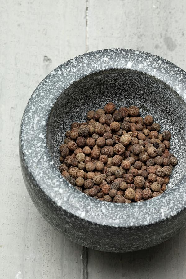 Allspice Berries In A Mortar Photograph by Krger & Gross