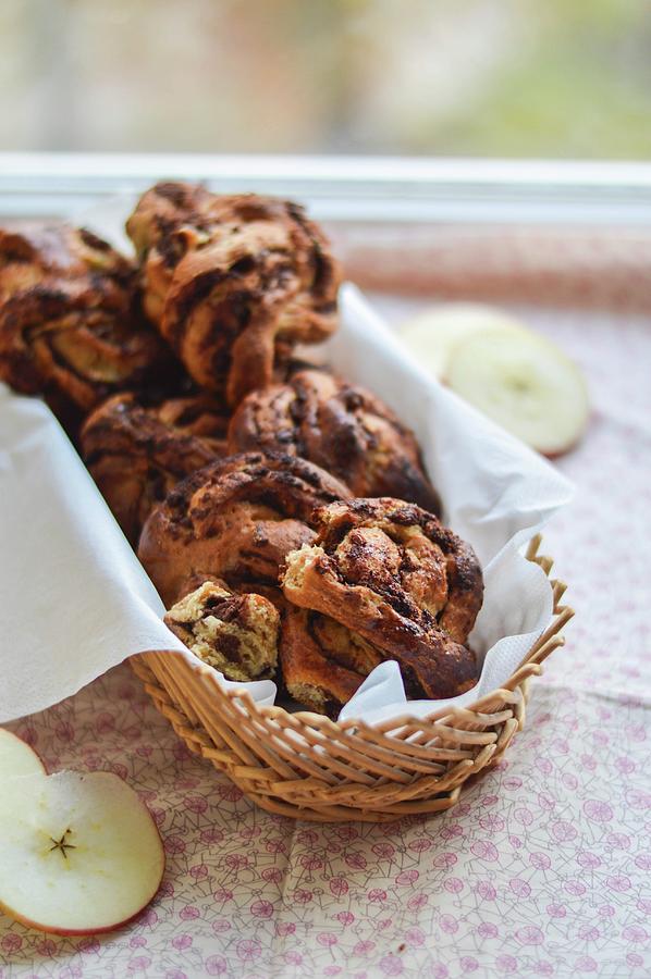 Almond And Apple Cakes With Chocolate In A Bread Basket Photograph by Sarah Levannier