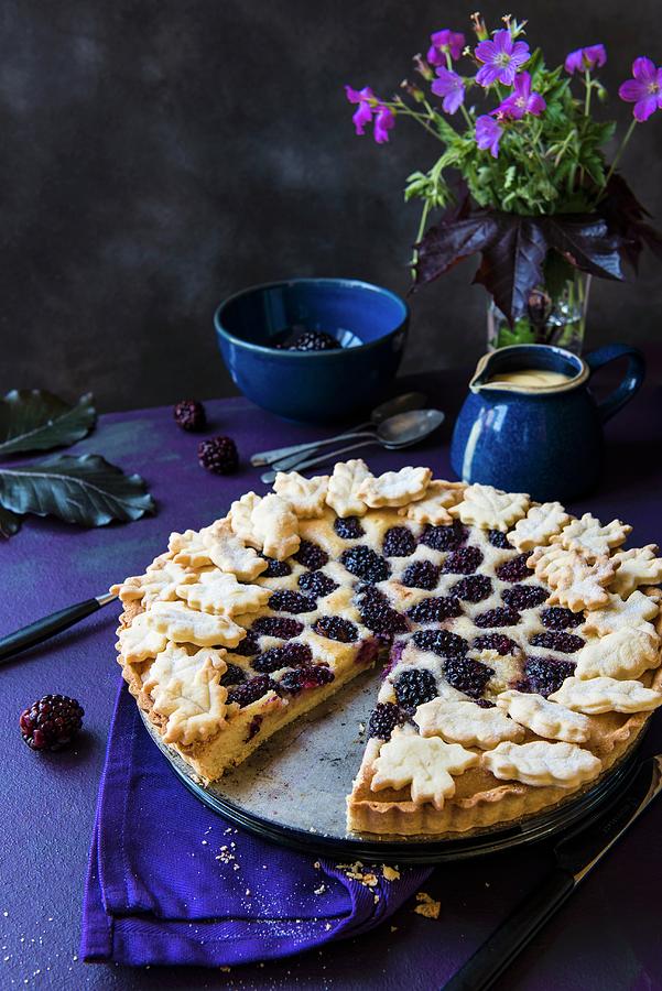 Almond And Blackberry Tart, Sliced, With A Jug Of Vanilla Sauce Photograph by Magdalena Hendey