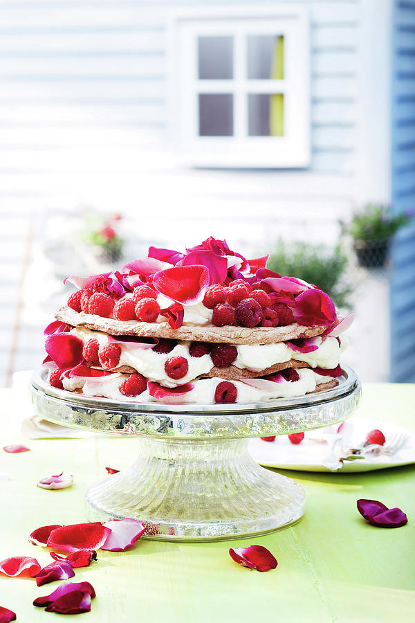Almond And Raspberries Cream Cake Decorated With Rose Petals On Cakestand Photograph by Jalag / Jan C. Brettschneider