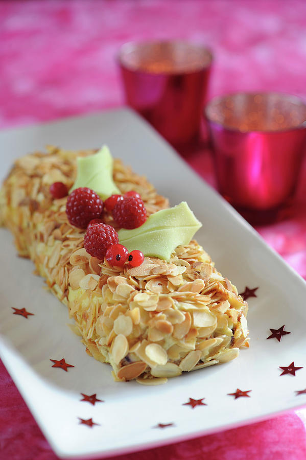 Almond And Red Fruit Log Cake Photograph by Schmitt
