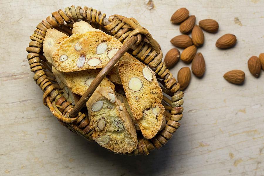 Almond Biscotti In A Basket Photograph by Nicole Godt