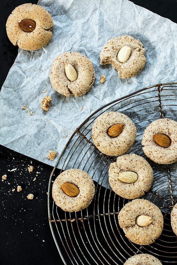 Almond Biscuits On And Beside A Cooling Rack Photograph by Dees Kche