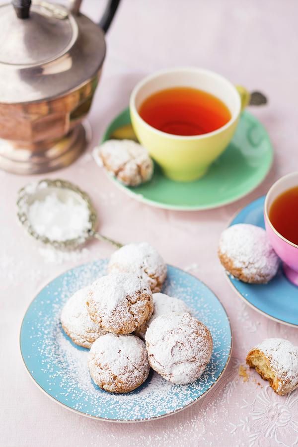 Almond Biscuits With Icing Sugar Served With Tea Photograph by Great Stock!