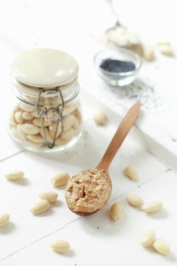 Almond Butter On A Wooden Spoon Photograph by Jane Saunders
