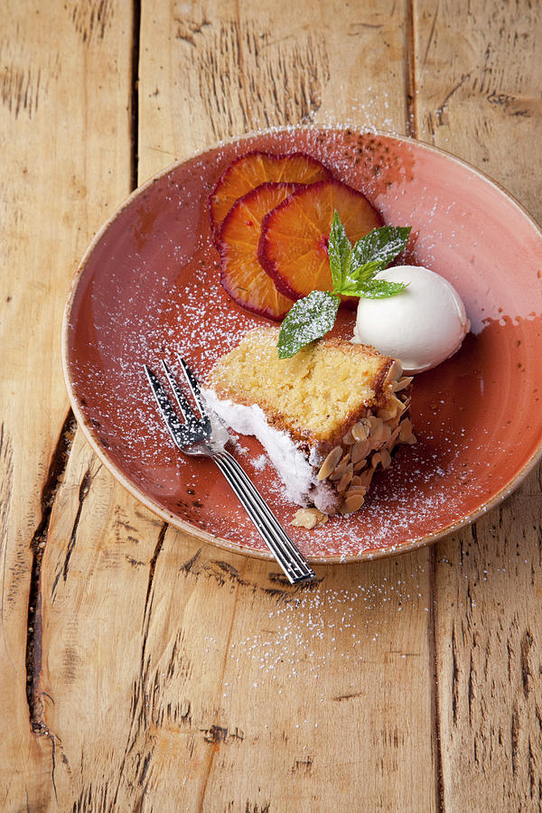 Almond Cake With Lemon Ice Cream Photograph by Michael Wissing