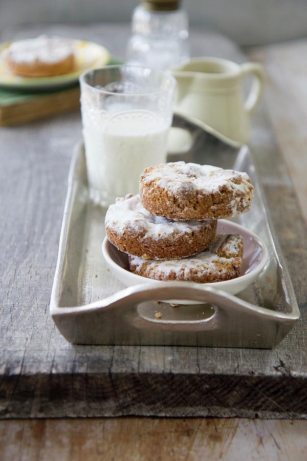 Almond Cakes Dusted With Icing Sugar Photograph by Patricia Miceli
