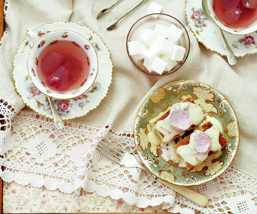 Almond Cakes Topped With Rose Petals And Sugar Icing, With Rose Tea And Sugar Cubes Photograph by Osborne, Ria