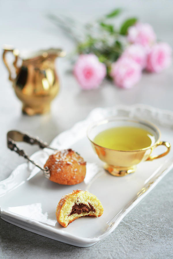 Almond Cakes With Chocolate Filling And Tea On A Porcelain Tray Photograph by Mariola Streim