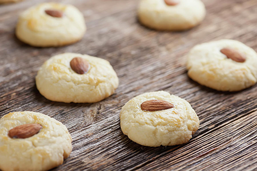 Almond Cookies On A Wooden Background Photograph by Framed Cooks Photography