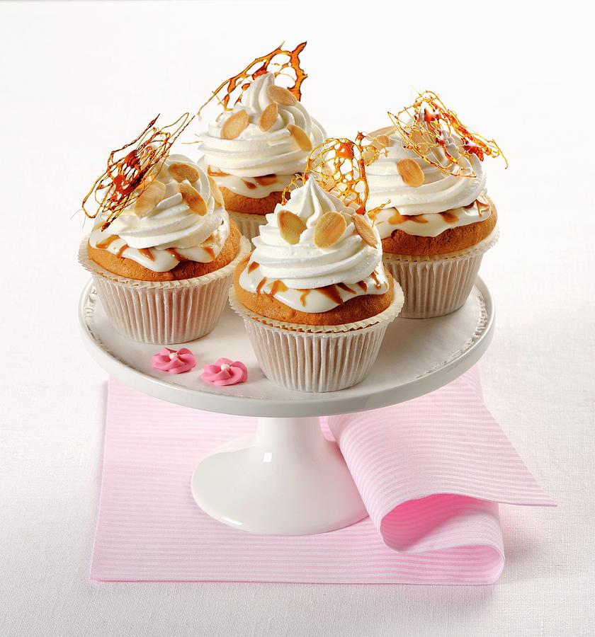 Almond Cupcakes With Caramel And Cream Photograph by Franco Pizzochero
