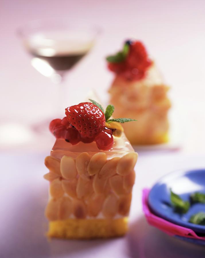 Almond Gateau With Berries, Served With A Glass Of Dessert Wine Photograph by Blueberrystudio