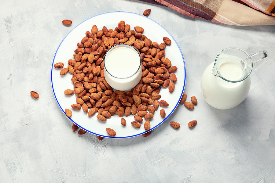 Almond Milk And Nuts Photograph by Tatjana Baibakova