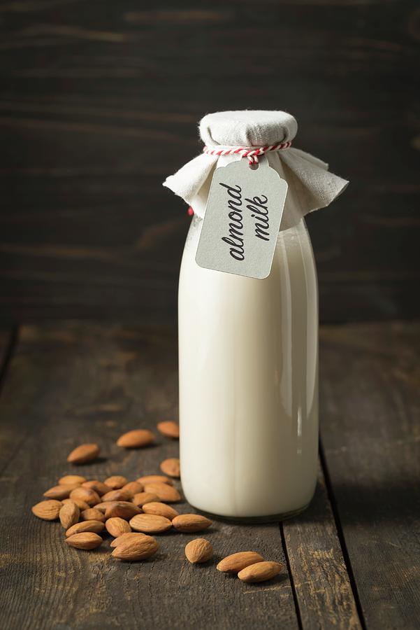 Almond Milk In A Glass Bottle With A Label Photograph by Elisabeth Clfen
