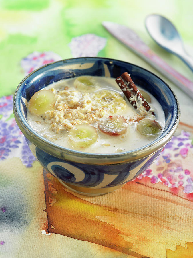 Almond Milk Soup With Porridge, Grapes, Cinnamon And Coconut Photograph by Lawton