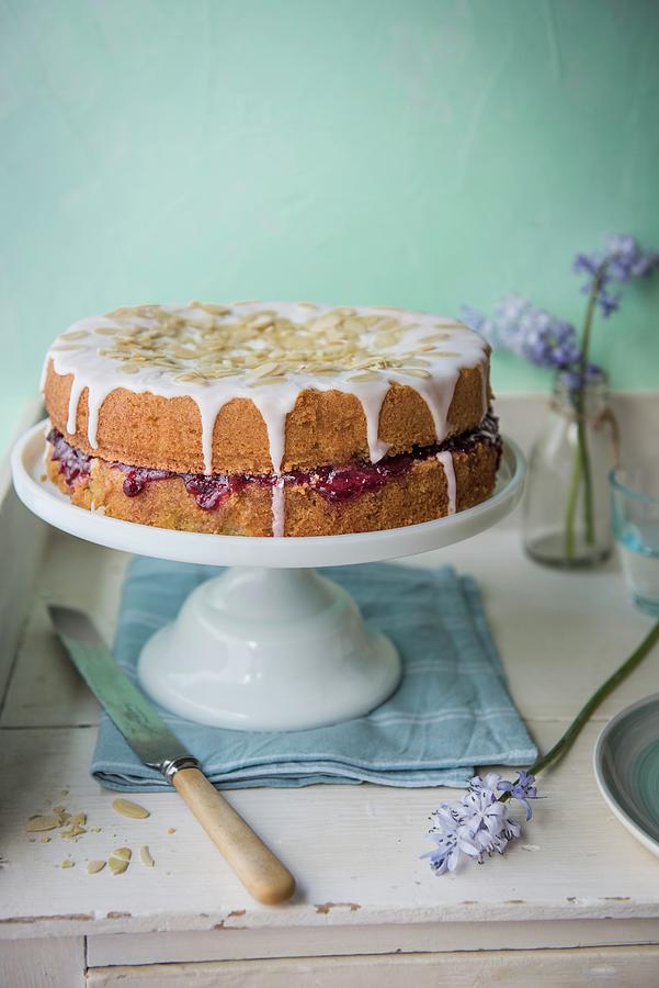 Almond Sponge Cake With Cherry Jam On The Cake Stand Photograph by ...