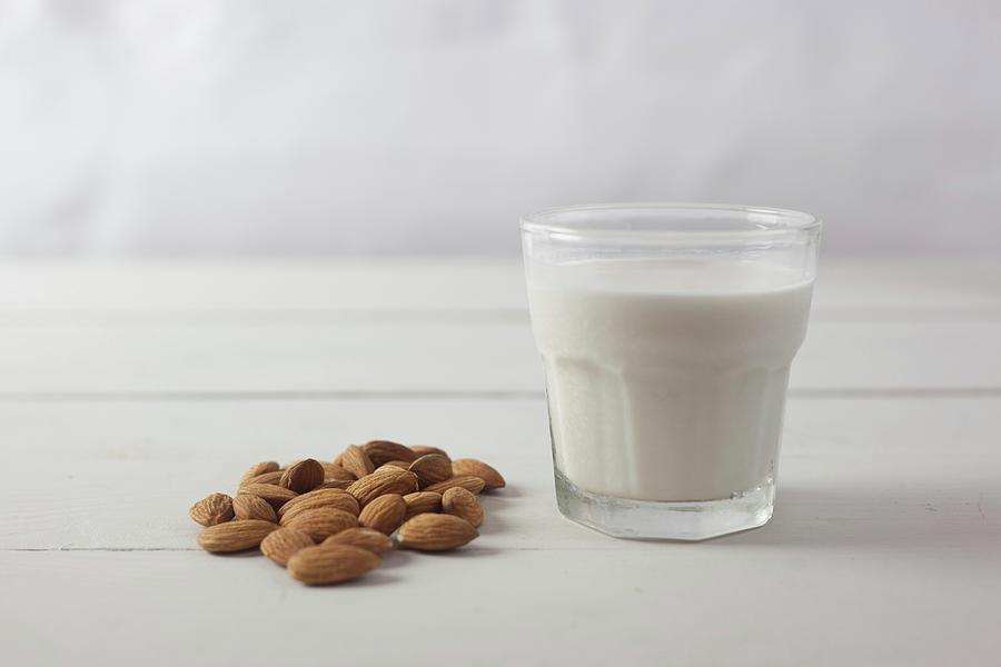 Almonds And A Glass Of Almond Milk Photograph by Isolda Delgado Mora