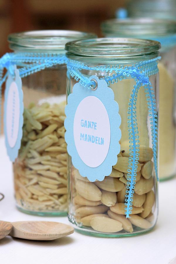 Almonds In Storage Jars With Hand-crafted Labels Photograph by Ruth Laing