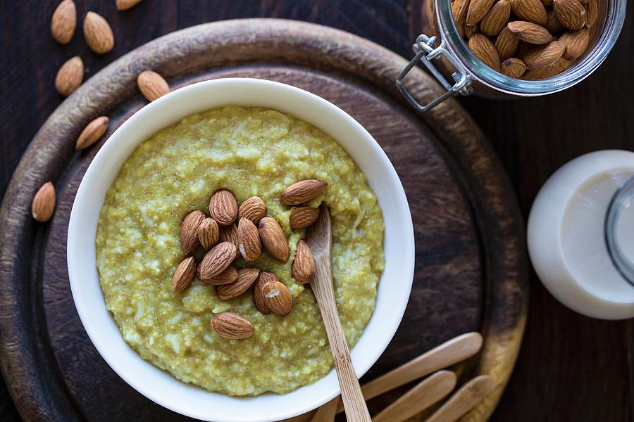 Amaranth, Millet And Rice Porridge With Roasted Almonds Photograph by Nicole Godt