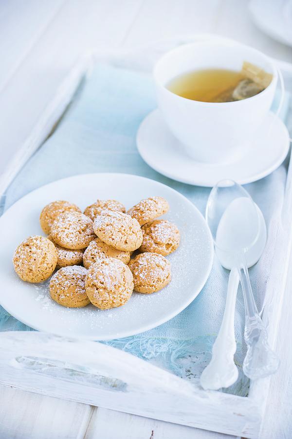 Amaretti Biscuits And A Teacup Photograph by Maricruz Avalos Flores