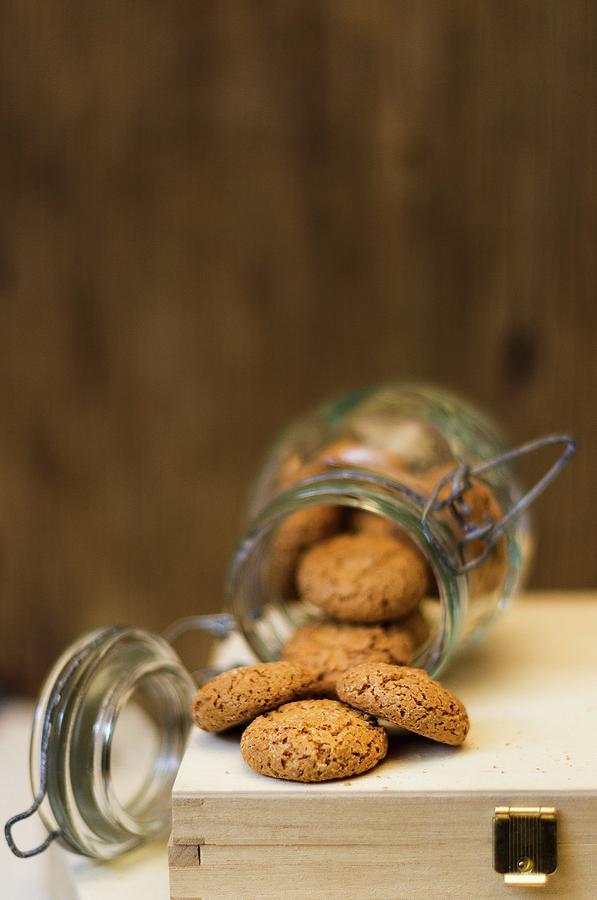 Amaretti In An Overturned Jar Photograph by Adel Bekefi