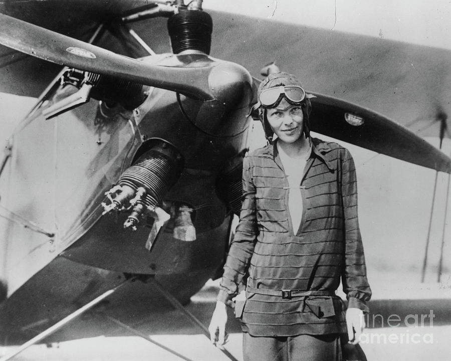 Ameila Earhart With Airplane Photograph by Getty Images