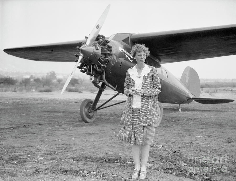 Amelia Earhart Posing With Her Plane Photograph by Bettmann