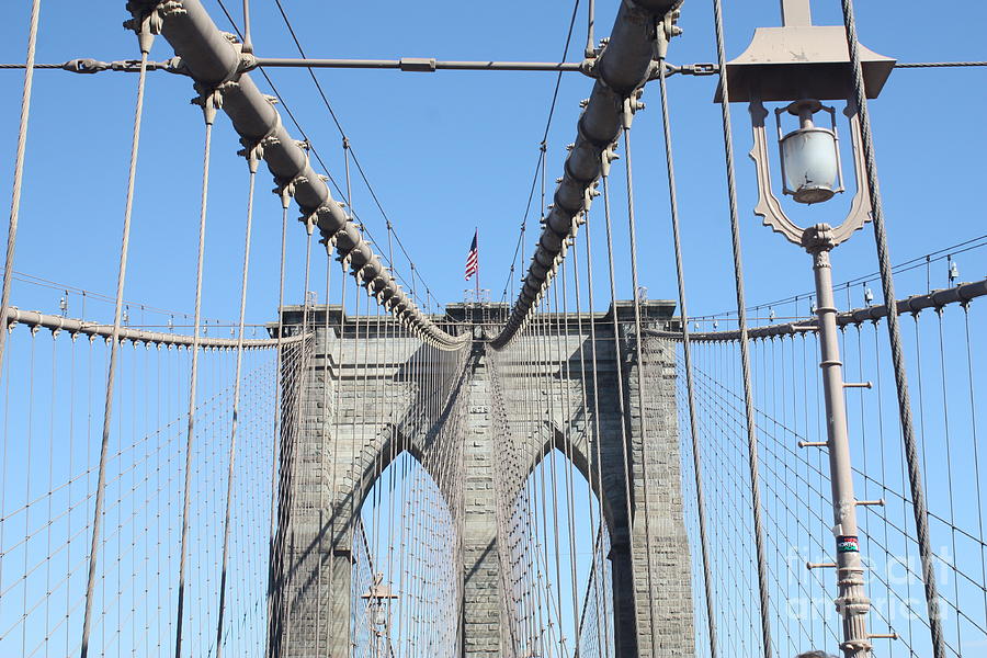 Old Fashioned St Light And Us Flag On The Brooklyn Bridge Photograph by John Telfer