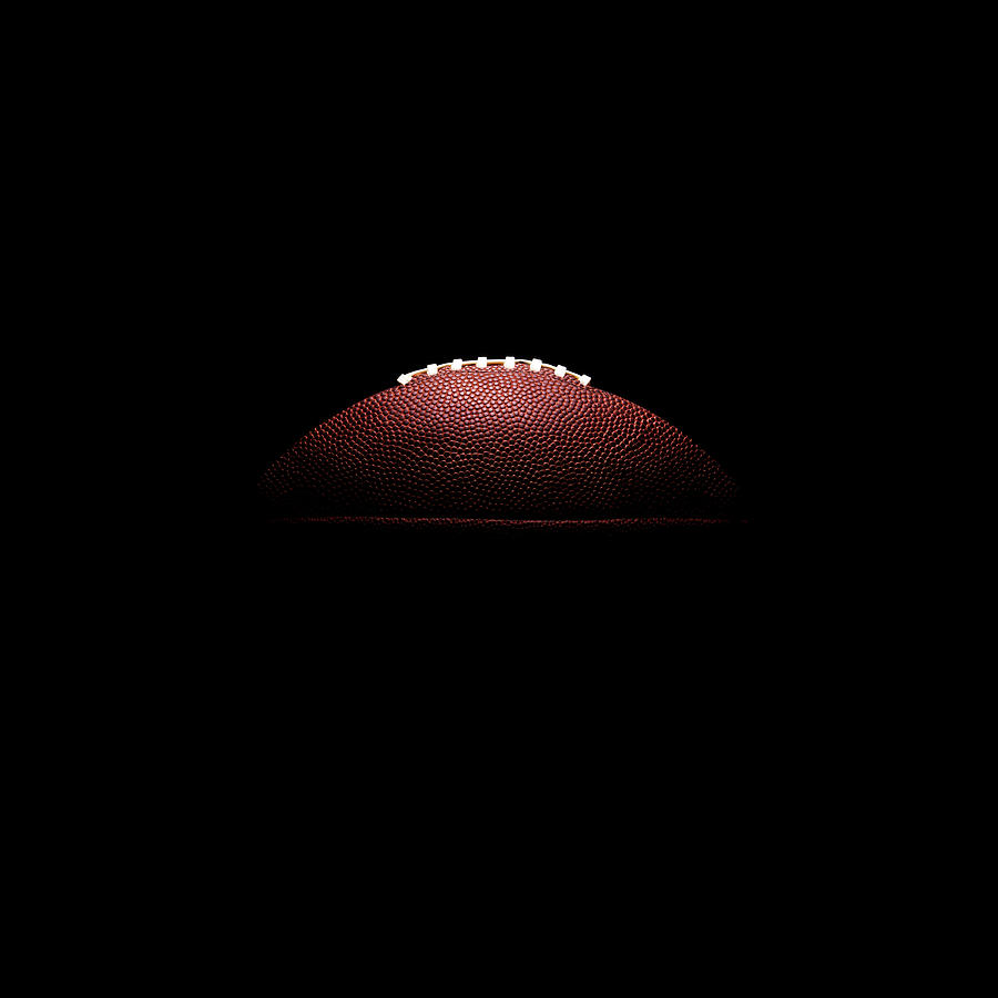 American Football Ball On Black Photograph by Thomas Northcut
