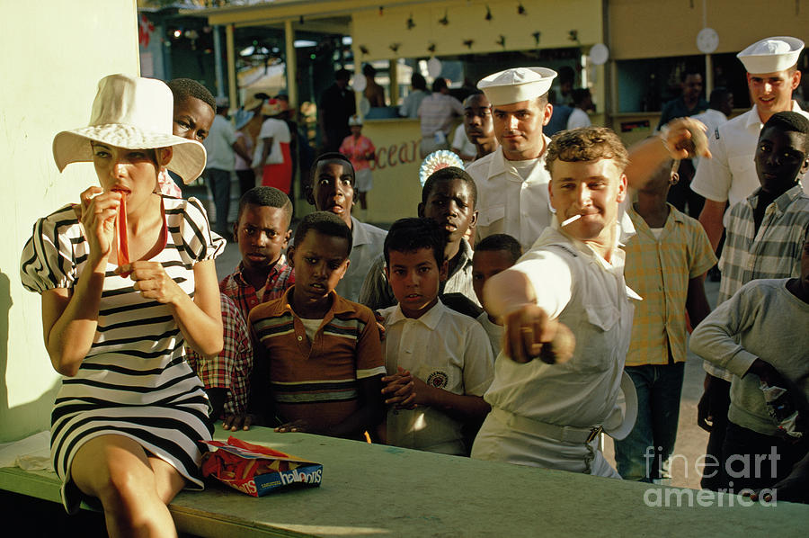 Charlotte Amalie Photograph - American Sailors Play Carnival Games At A Transfer Day Festival. by James L Stanfield Charlotte Amalie Photograph - American Sailors Play Carnival Games At A Transfer Day Festival. by James L Stanfield