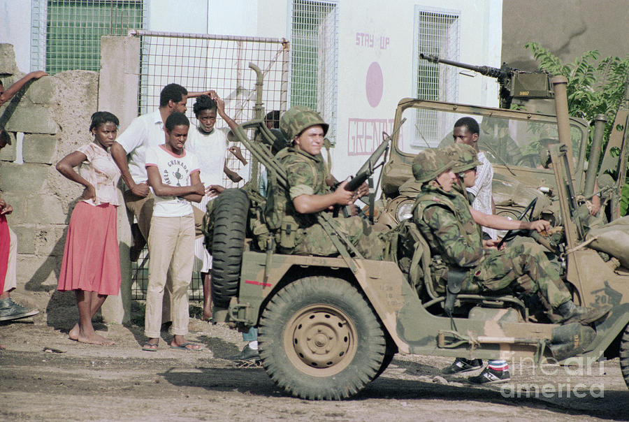American Soldiers Drive Past Civilians Photograph by Bettmann
