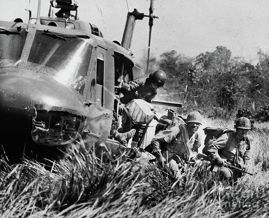 American Soldiers Exit A Helicopter Photograph by Bettmann
