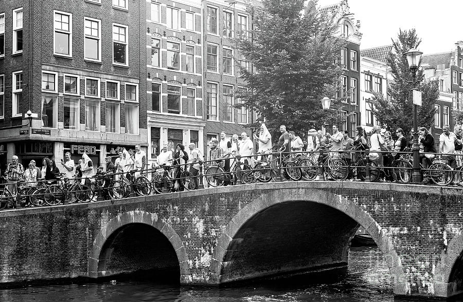 Amsterdam Canal Bridge Crowds Photograph by John Rizzuto