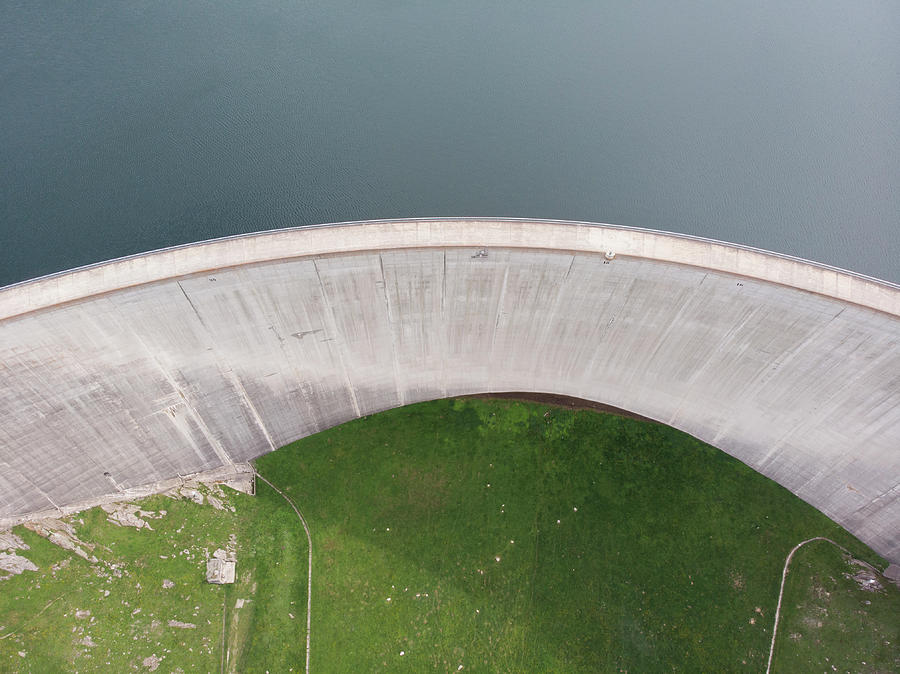 Architecture Photograph - An Aerial View Of A Swiss Engineered Dam by Cavan Images