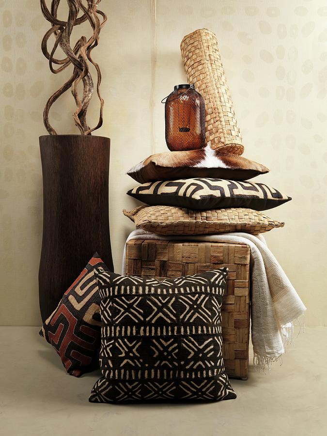An African Feel: Cushions In Shades Of Brown And A Floor Vase Holding Liana Wood Photograph by Biglife