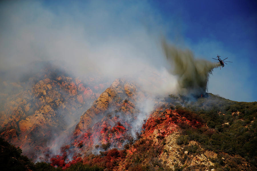 An Aircraft Drops Water As Firefighters Photograph by Eric Thayer ...