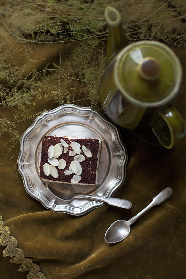 An Almond Cream Slice On A Pewter Plate Photograph by Alicja Koll