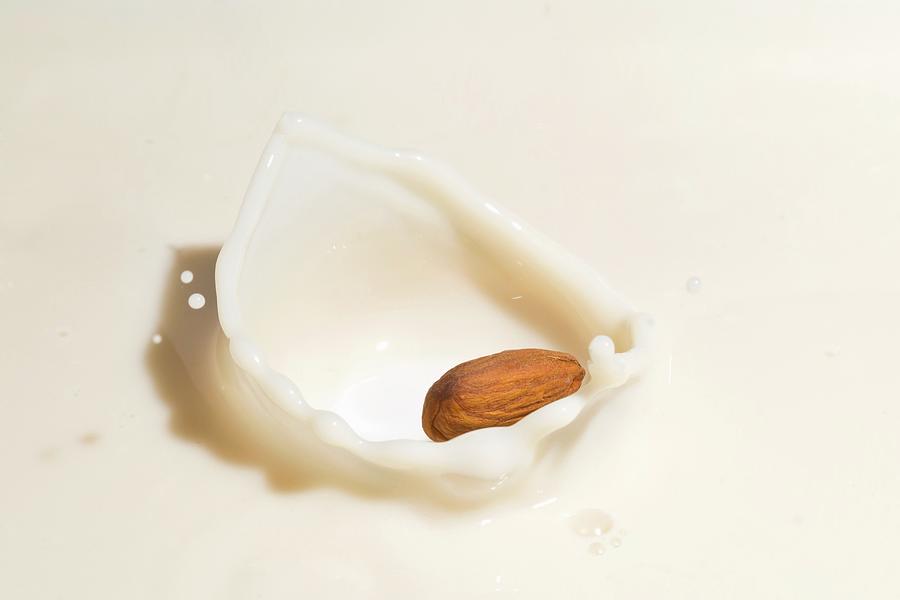 An Almond Falling Into Almond Milk Photograph by Shawn Hempel