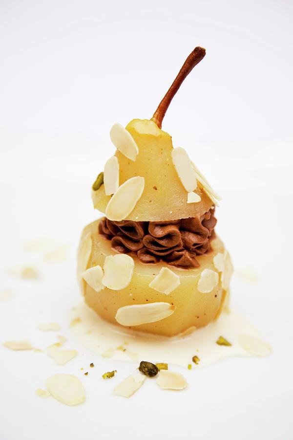 An Almond Pear Filled With Chocolate Mousse And Pistachio Ice Cream Photograph by Michael Wissing