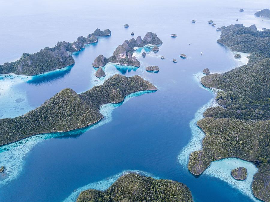 Nature Photograph - An Amazing Set Of Limestone Islands by Ethan Daniels